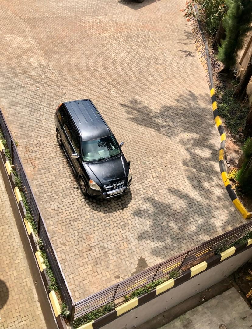 Secure paved parking area at The Address Resort