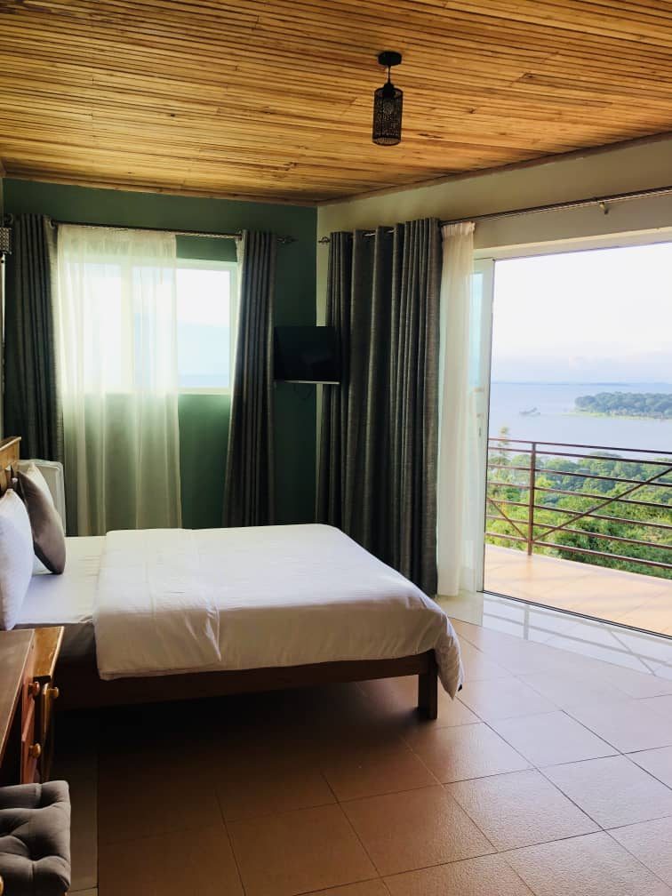 Premium Room bed beside the lake-view balcony